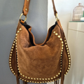 Camel Brown Slouch Crescent Shoulder Bag With Perimeter Gold Stud Trim, Long Side Fringe Tassels, Adjustable Wide Shoulder Strap And Chunky Metal Ring Hardware