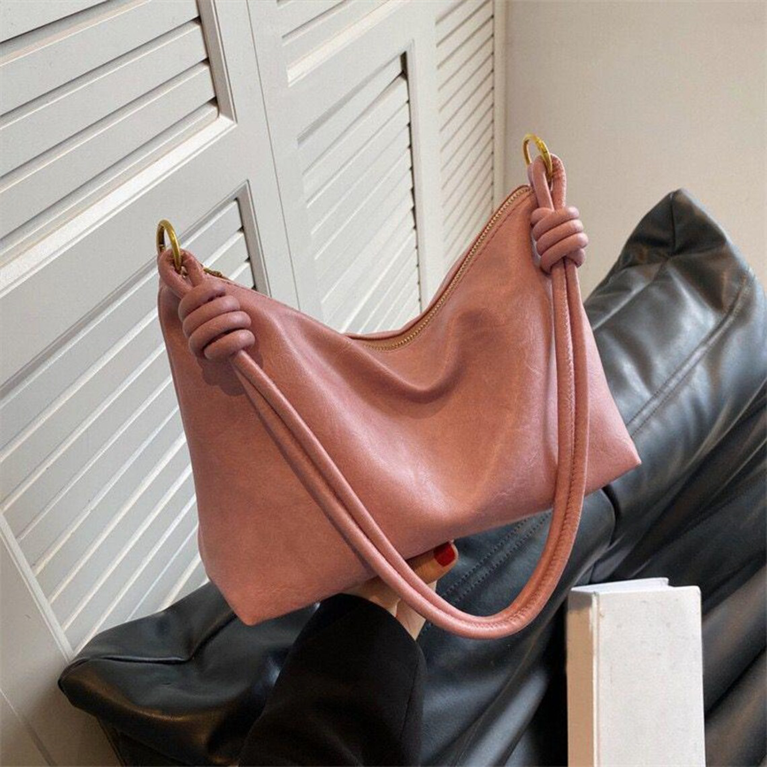 Blush Pink Soft Wrinkled Slouch Shoulder Bag With Coiled Knot Strap Detailing, Gold Metal Ring Fixtures And Full Curved Top Zipper Closure