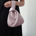 Lustrous Teardrop Knot Wrist Pouch With Interwoven Loop Strap Construction, Seamless Single Interior Cavity And Hardware-Free Minimalist Silhouette