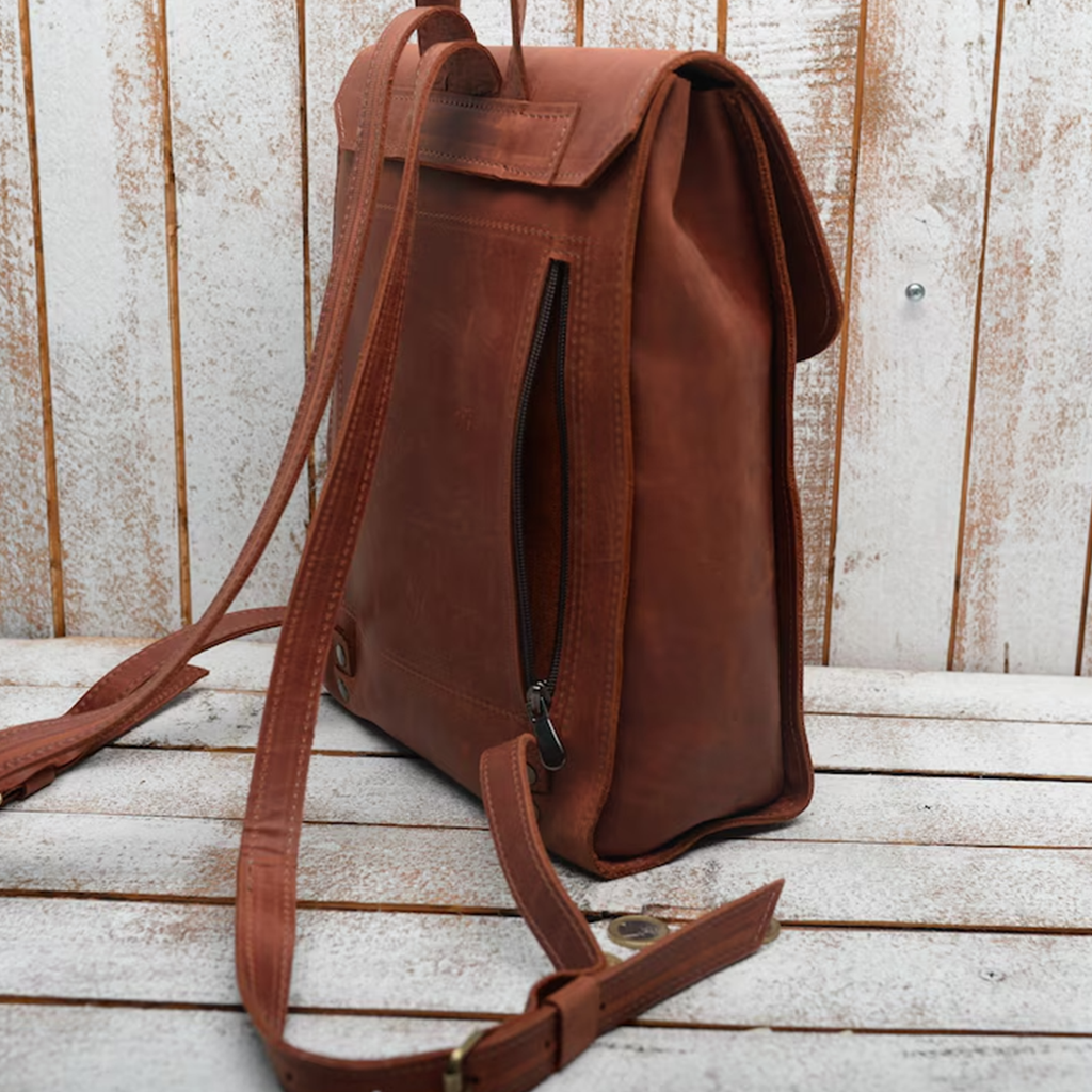 Vintage Rust Brown Vertical Fold Flap Rucksack With Antique Hook Ring Fastener, Curved Top Hand Loop, Side Access Zip Pocket And Adjustable Matching Shoulder Straps